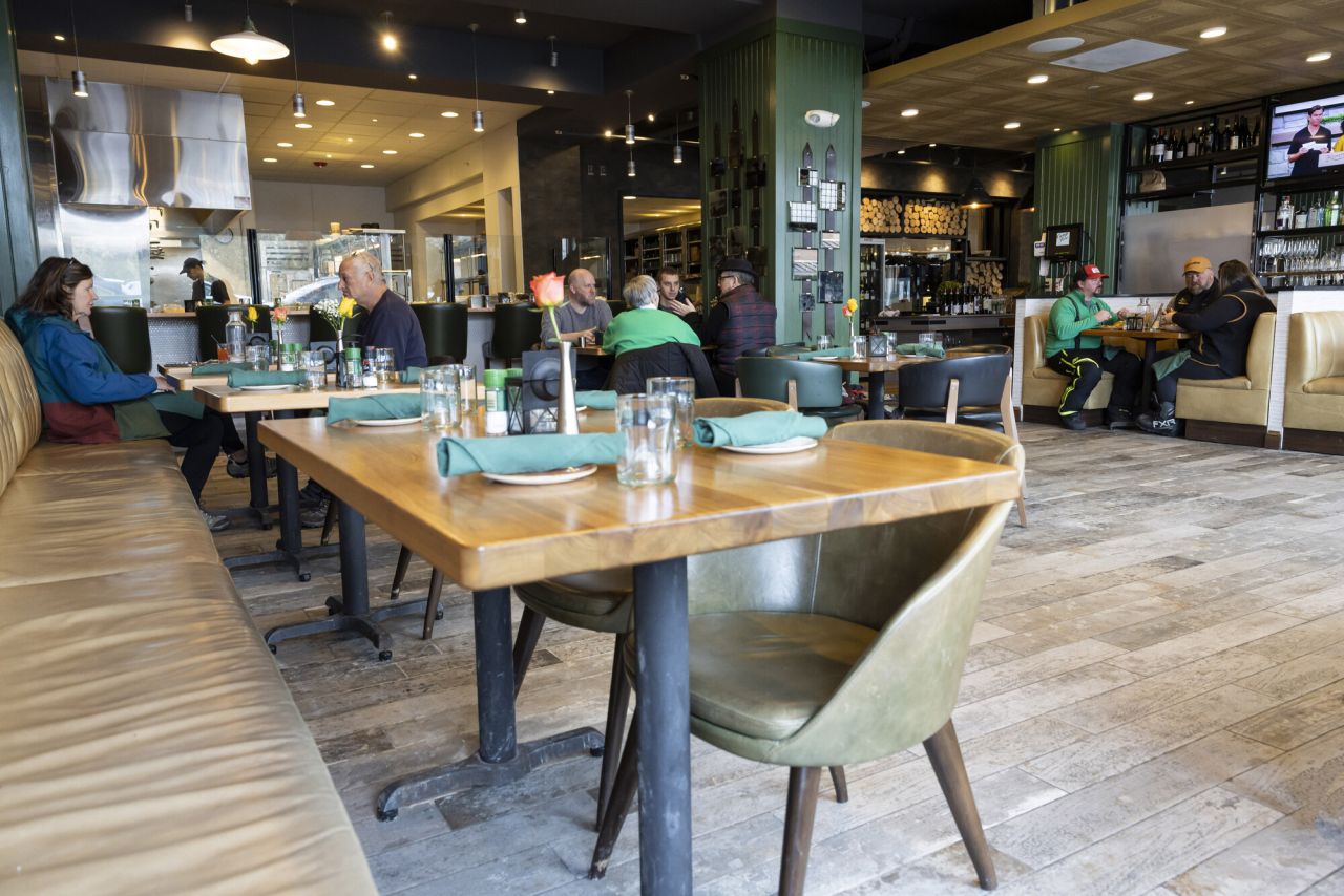 tables at restaurant with a few dinners in teh background