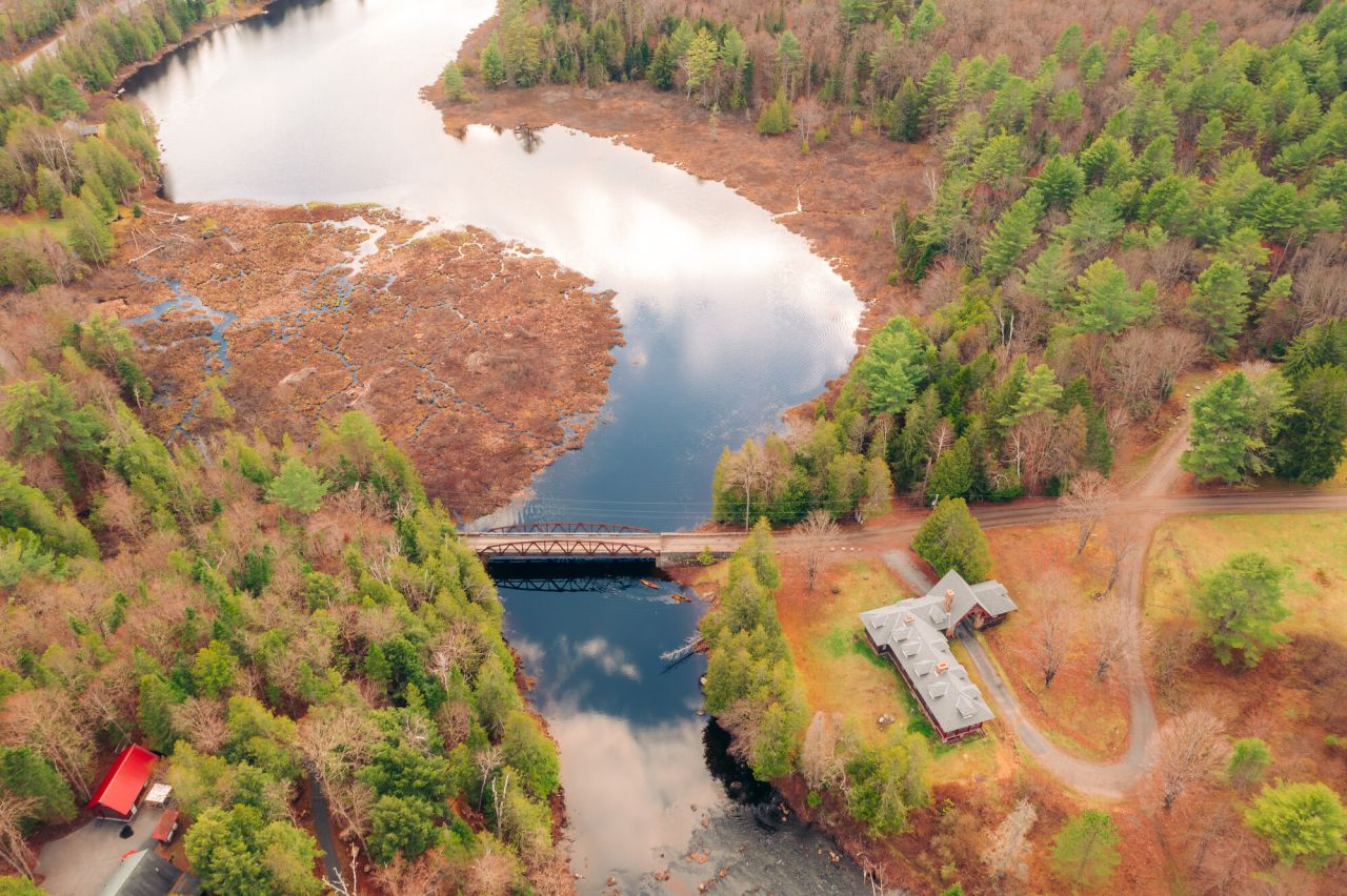 A river carves through spring scenery. 