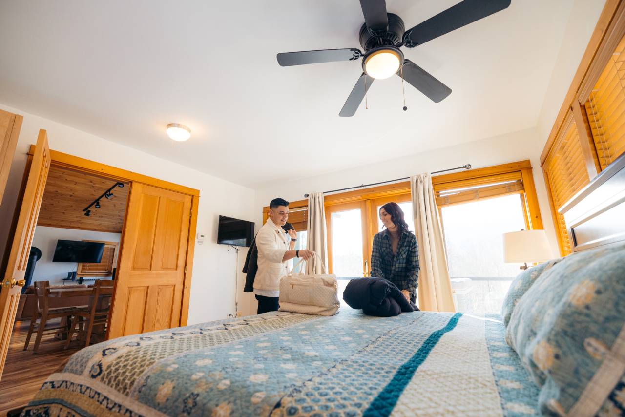 A couple staying at a vacation rental in the Whiteface Region.