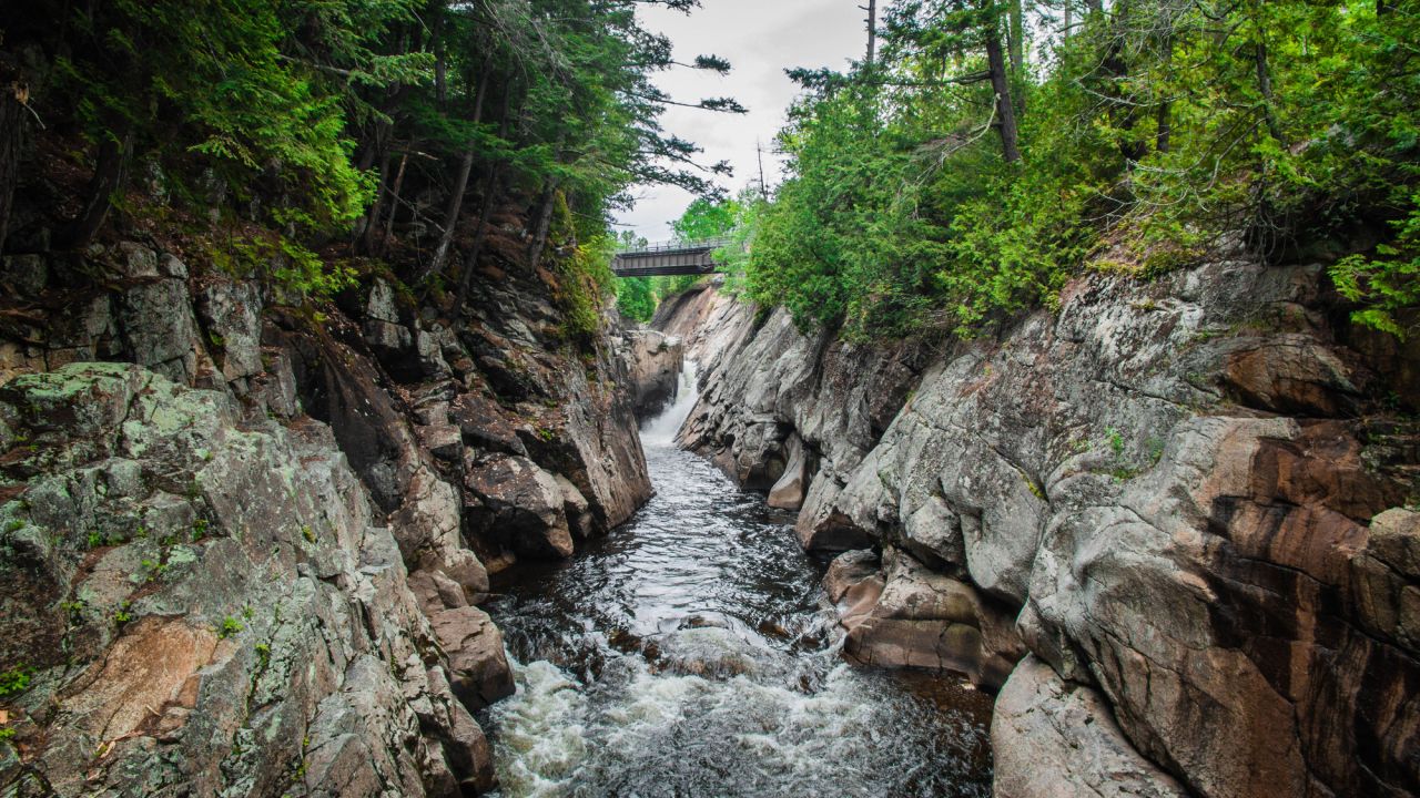 View upstream of Flume Falls and the highway bridge on Rte 86