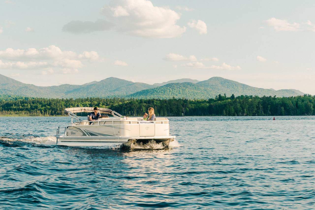 A family enjoying a pontoon boat on Oseetah