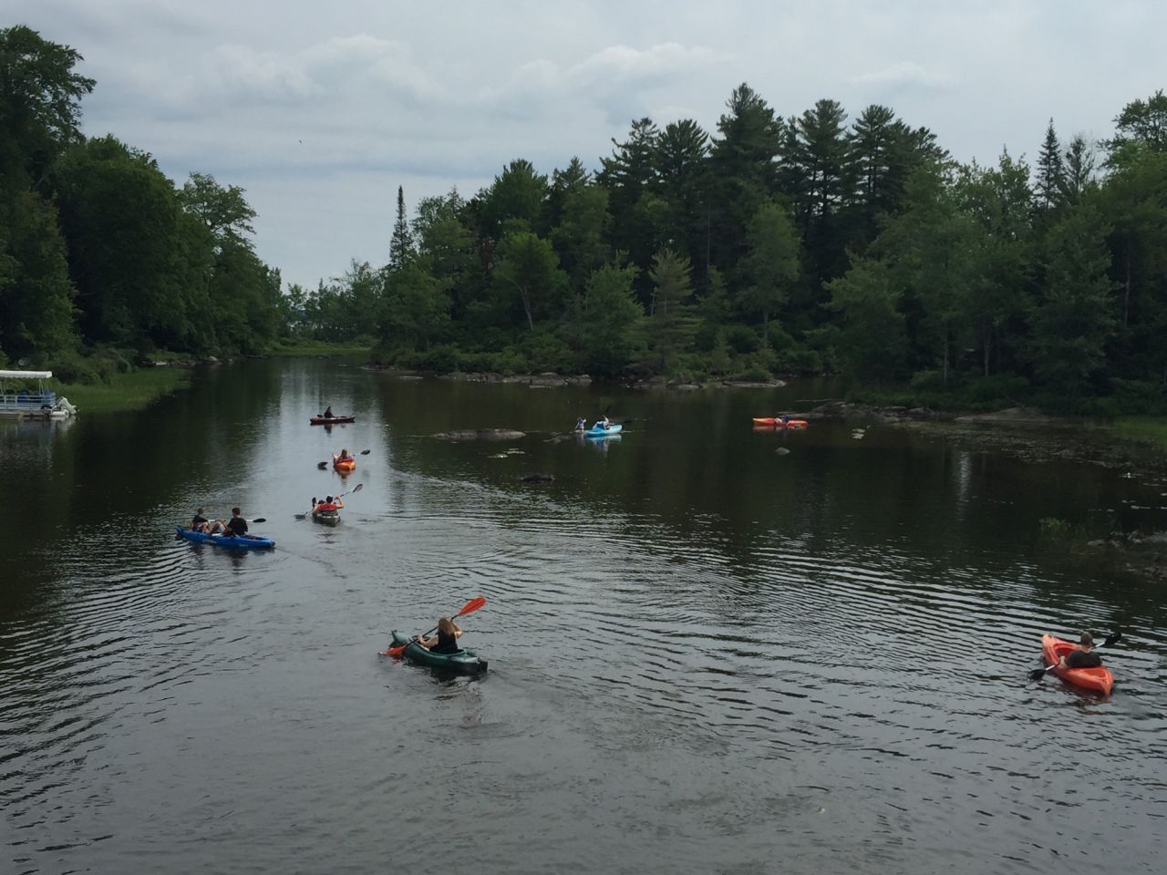 Paddlers on a lake in the summer.