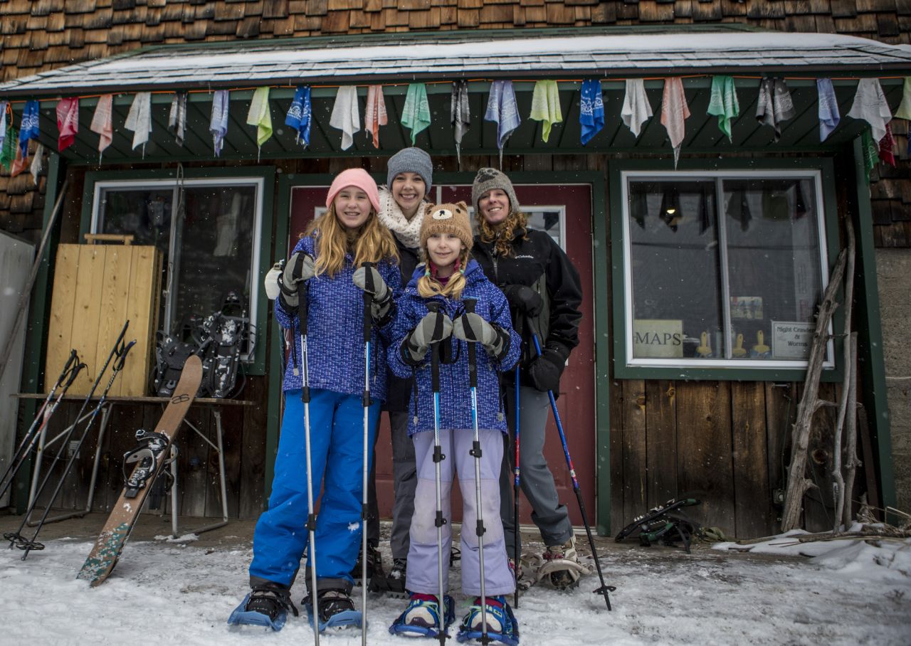 A family on snowshoes.