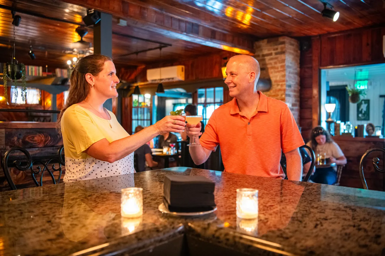 Couple at the Woodshed Bar, cheers