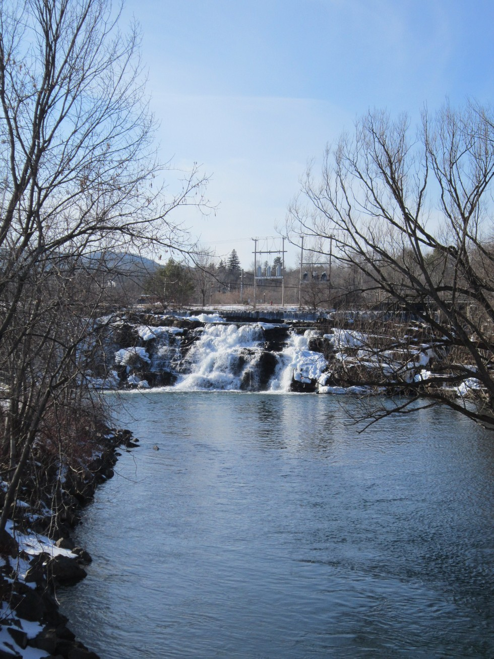 A multi-tier waterfall in winter.