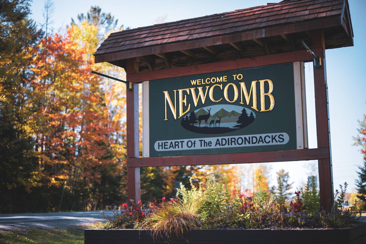 A town sign for Newcomb, New York. 