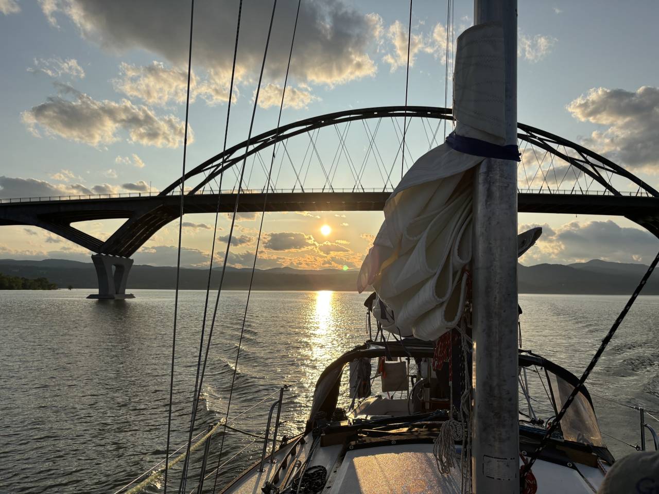 Sail Adirondacks sunset sail ride with views of the Champlain  Bridge.