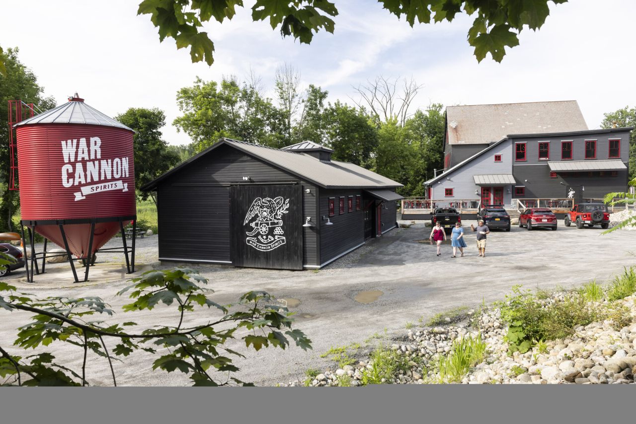 A brewery with a red sill with a white logo.