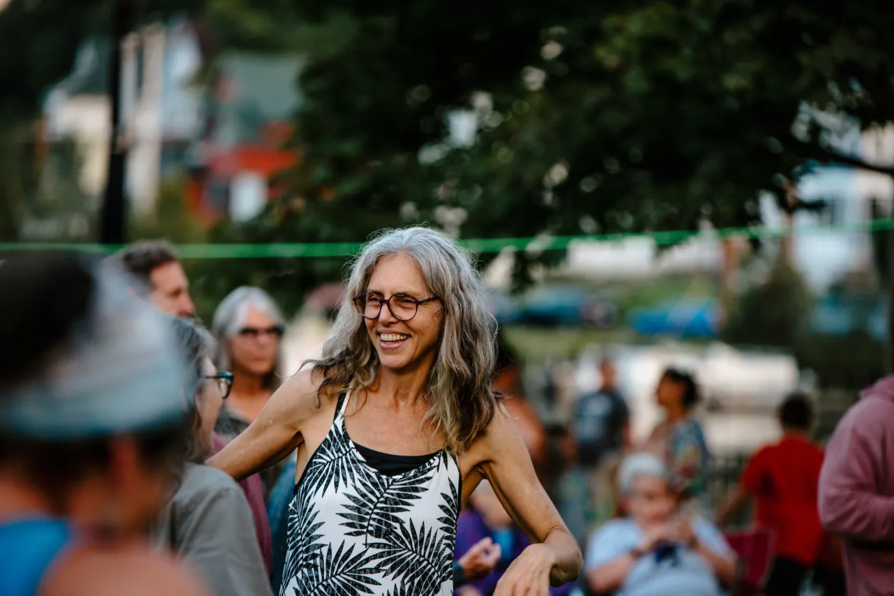 A woman dancing to live music.