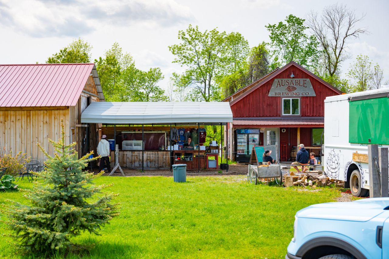 A barn with outdoor bar serving up beer.