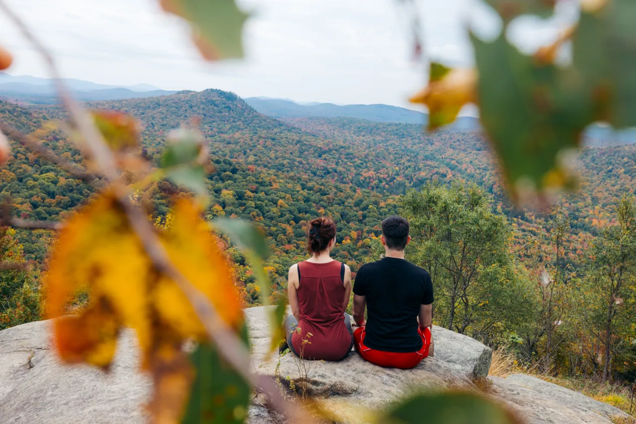 A couple sitting at a fall summit.