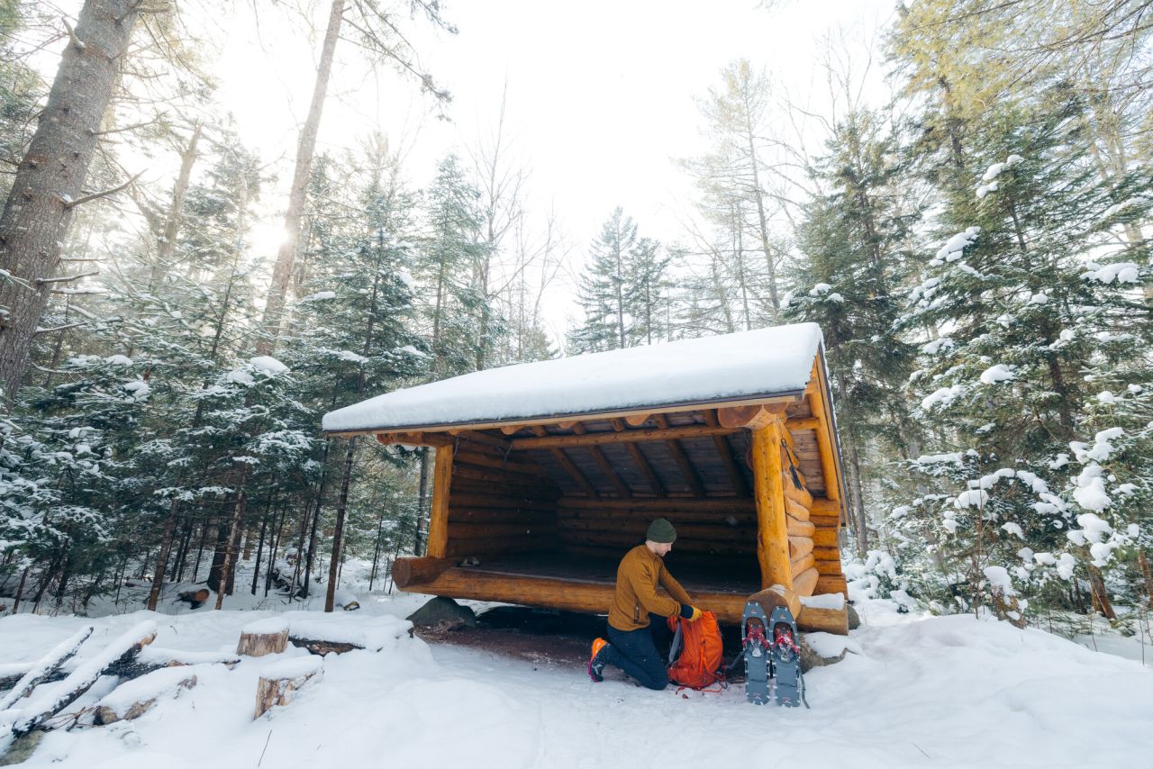Snowshoeing to a winter lean-to.