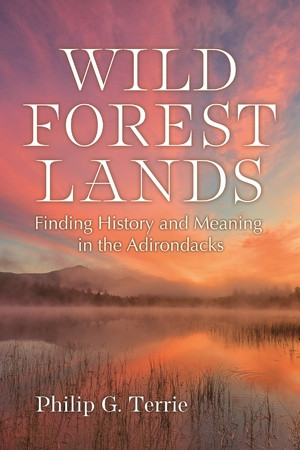 Book cover for "Wild Forest Lands: Finding History and Meaning in the Adirondacks" by Philip G. Terrie, showing a misty sunrise over a lake.