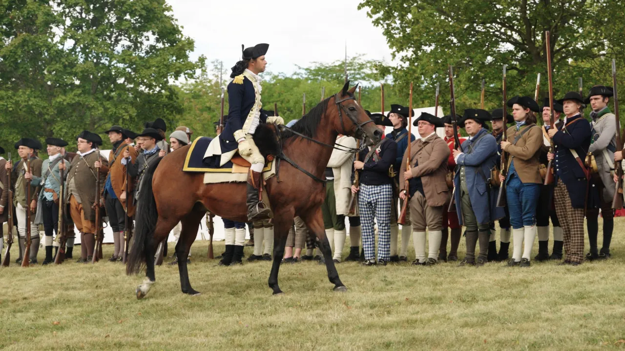reenactors giving command on a horse