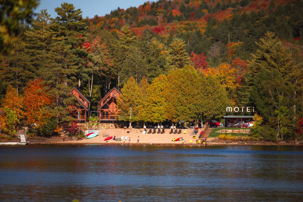A lakeside motel with cabins in the fall.
