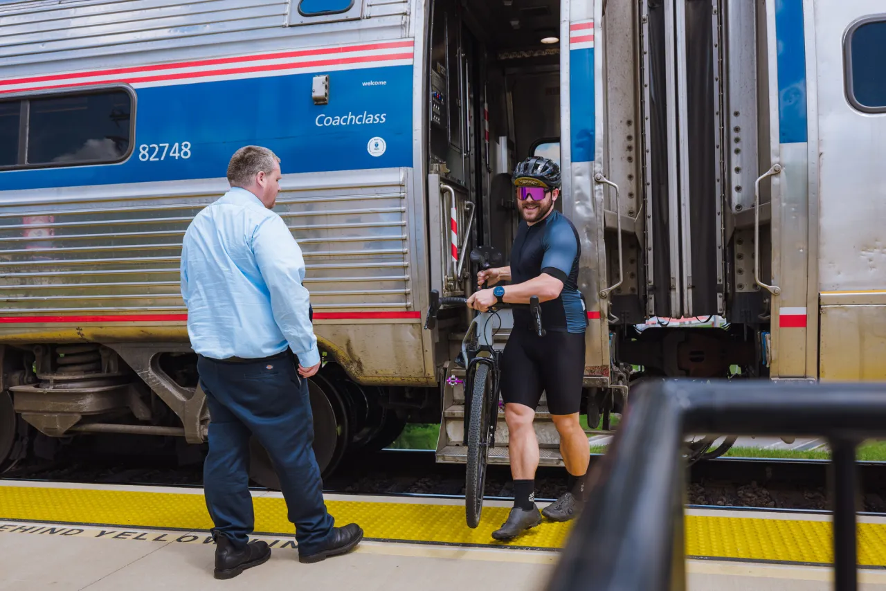 Stepping off the Amtrak with a bike.