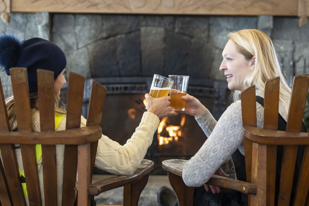 Two women cheersing at a brewery