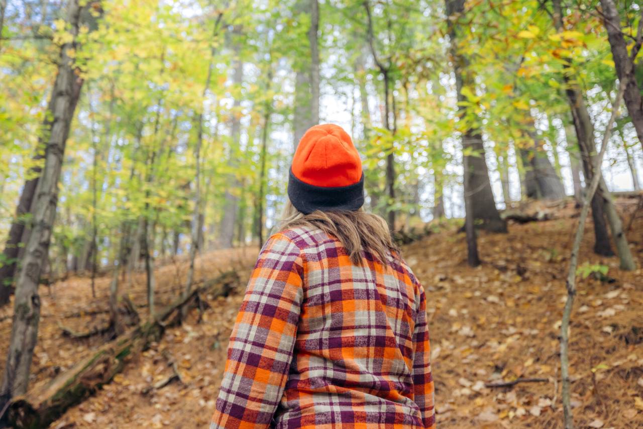 Woman hunting on path in the Fall