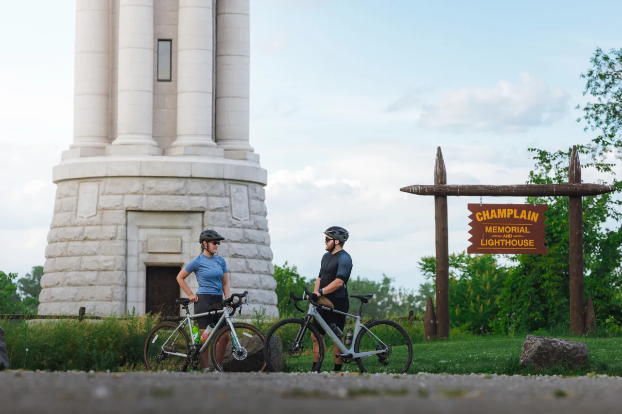 Two cyclists at the Champlain Memorial Lighthouse.