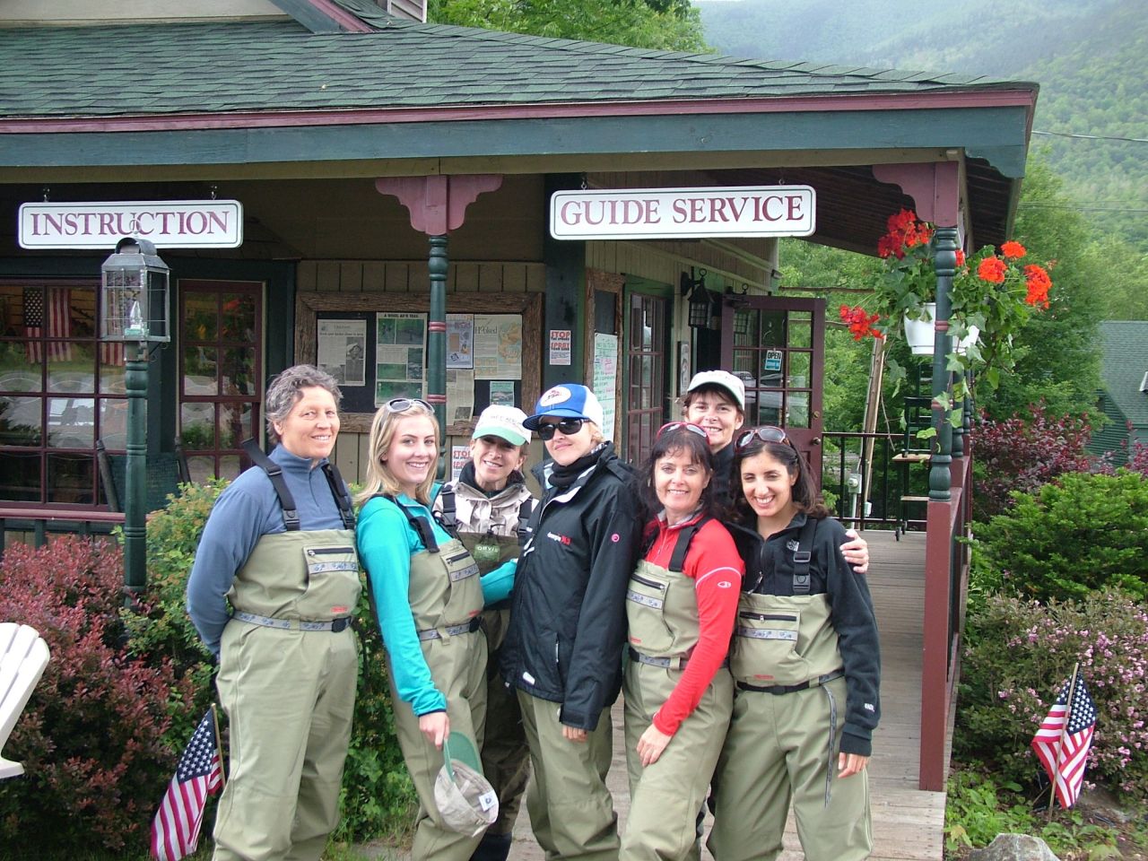 A group of fly fishers pose for a picture. 