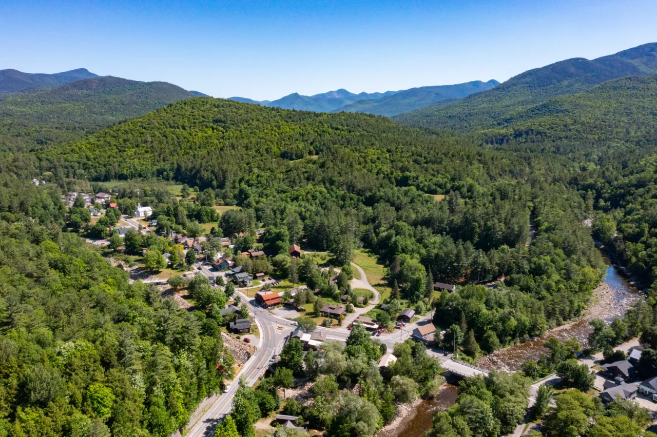 Aerial image of Route 73 and Route 9N intersection in Keene taken in summer with mountains in the distance
