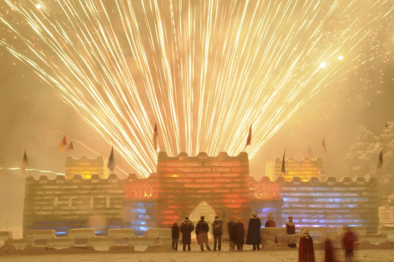 Fireworks lit up behind the Saranac Lake Winter Carnival ice palace.