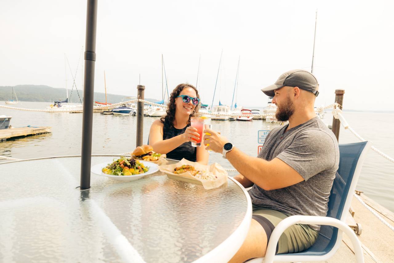 A couple having a meal and drinks at Portside