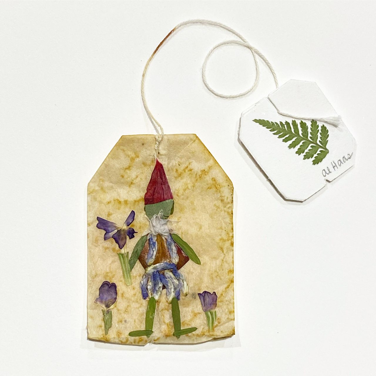 Wildly Pressed artwork on a teabag.