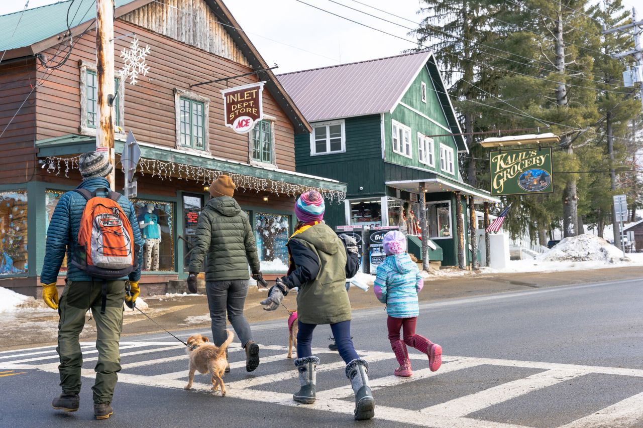 A family walking over to Inlet Department Store.