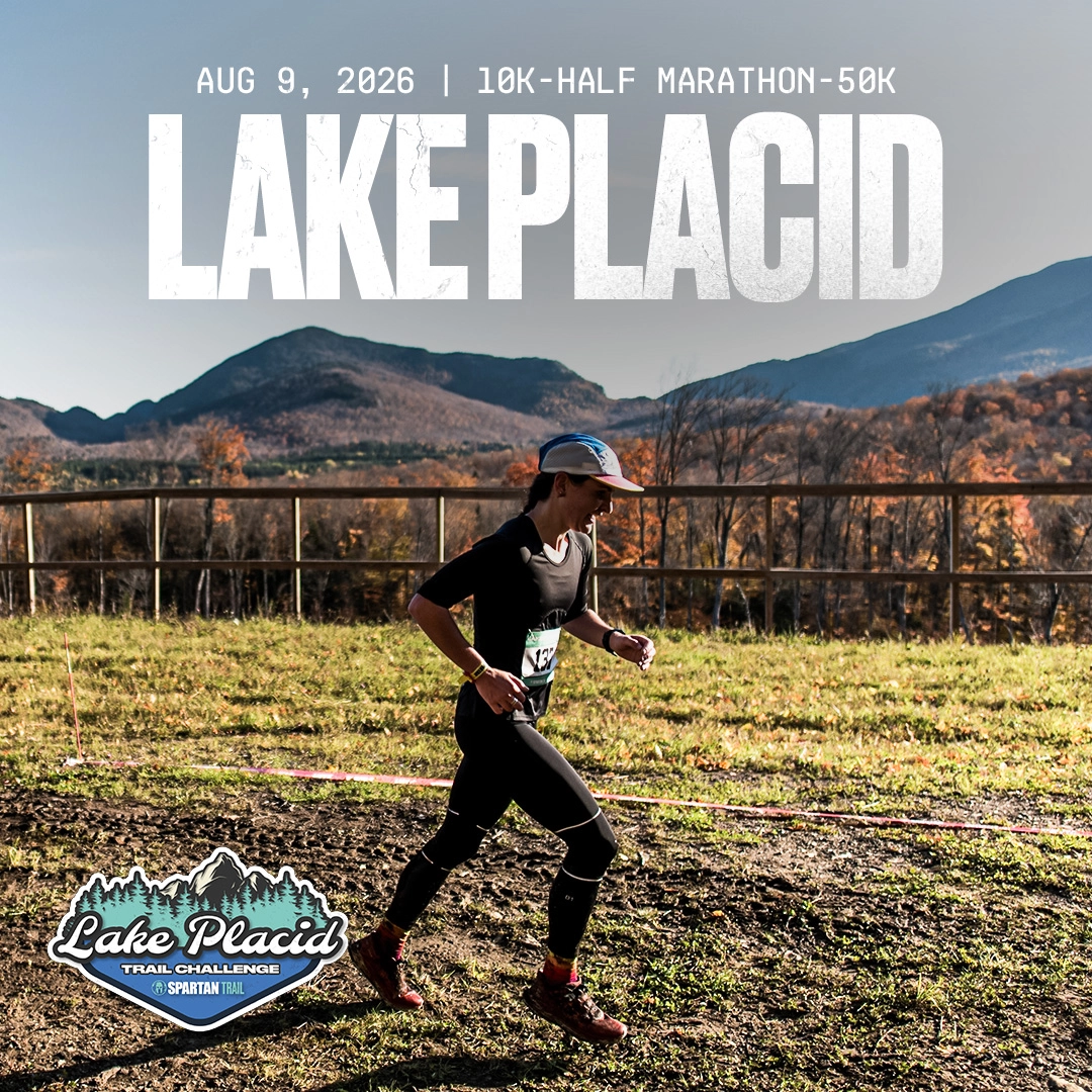 Person runs on trail at Mt Van Hoevenberg in fall with event logo in bottom left corner and race info in white header text
