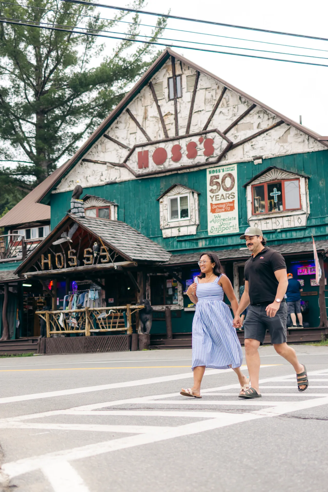 A couple walking by Hoss's general store.