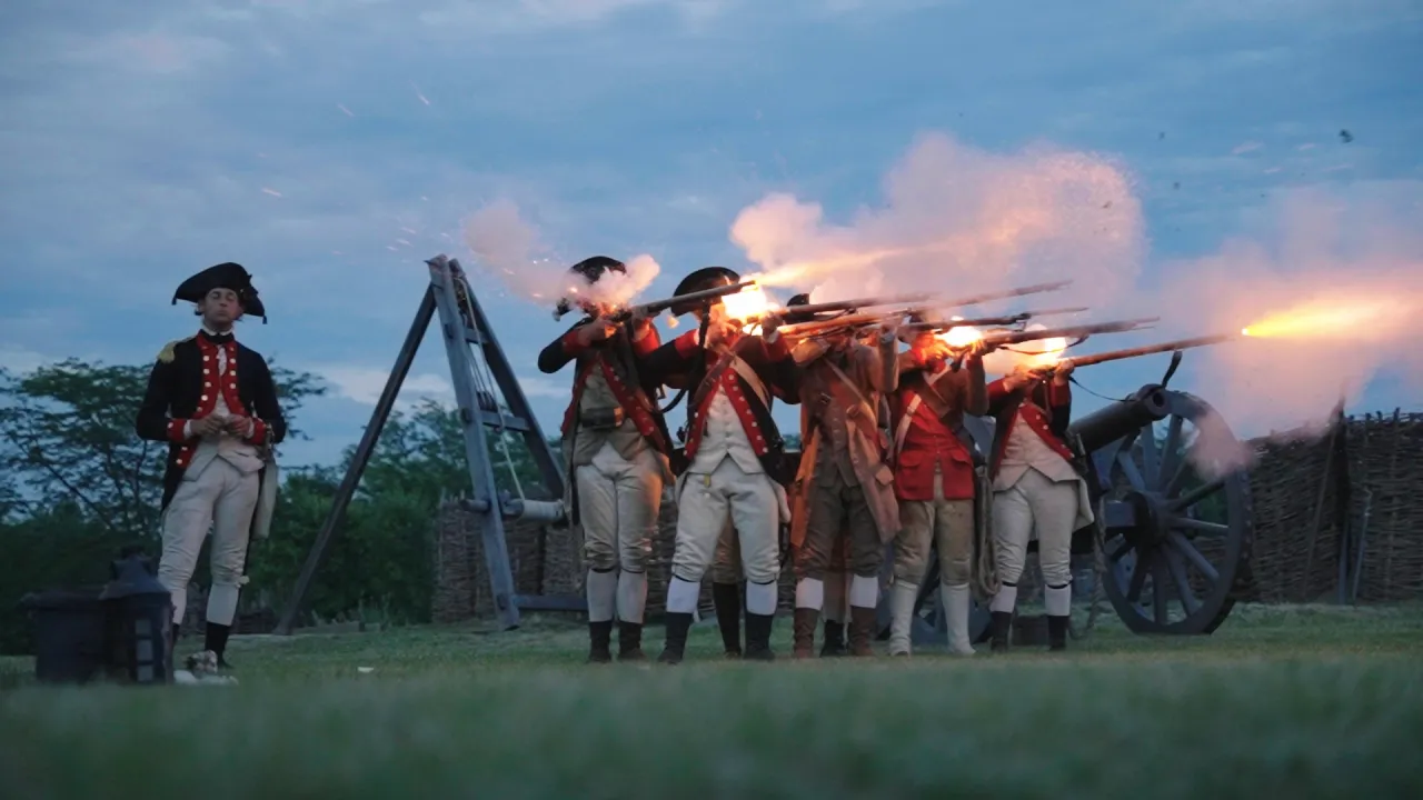 reenactors firing muskets