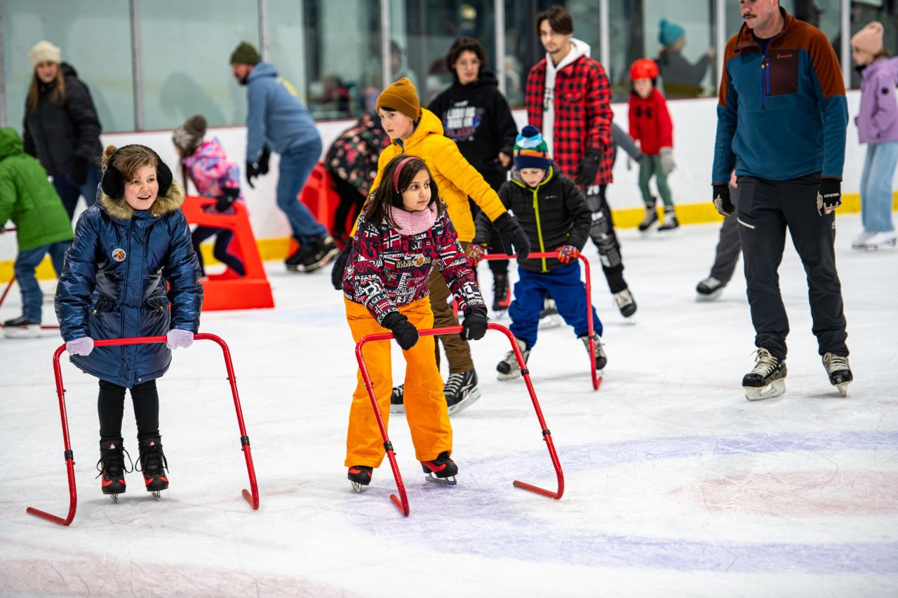 Kids skating at a civic center