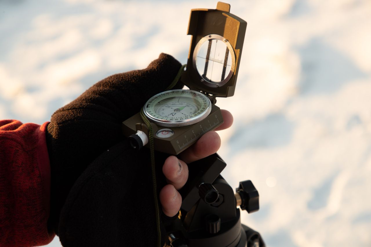 A compass in a hand