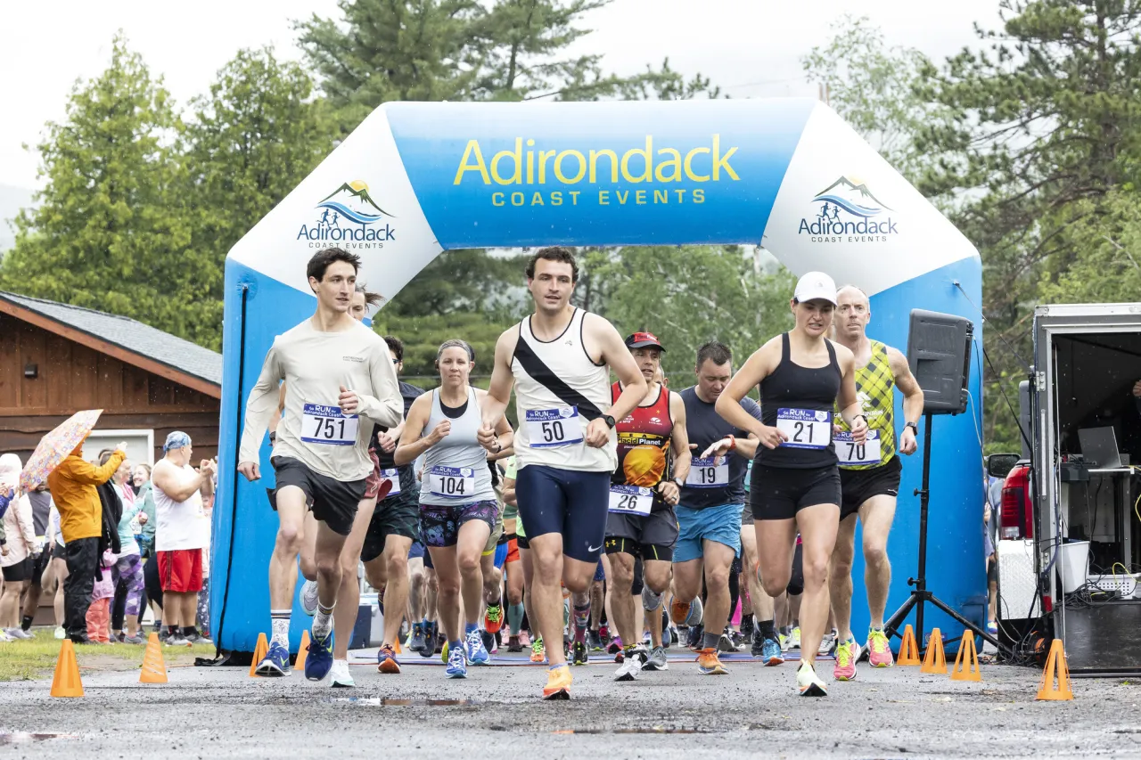 A group of runners set off on a race.
