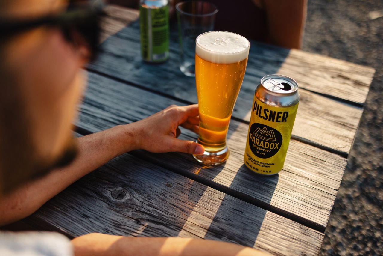 Paradox Brewery beer on a patio.