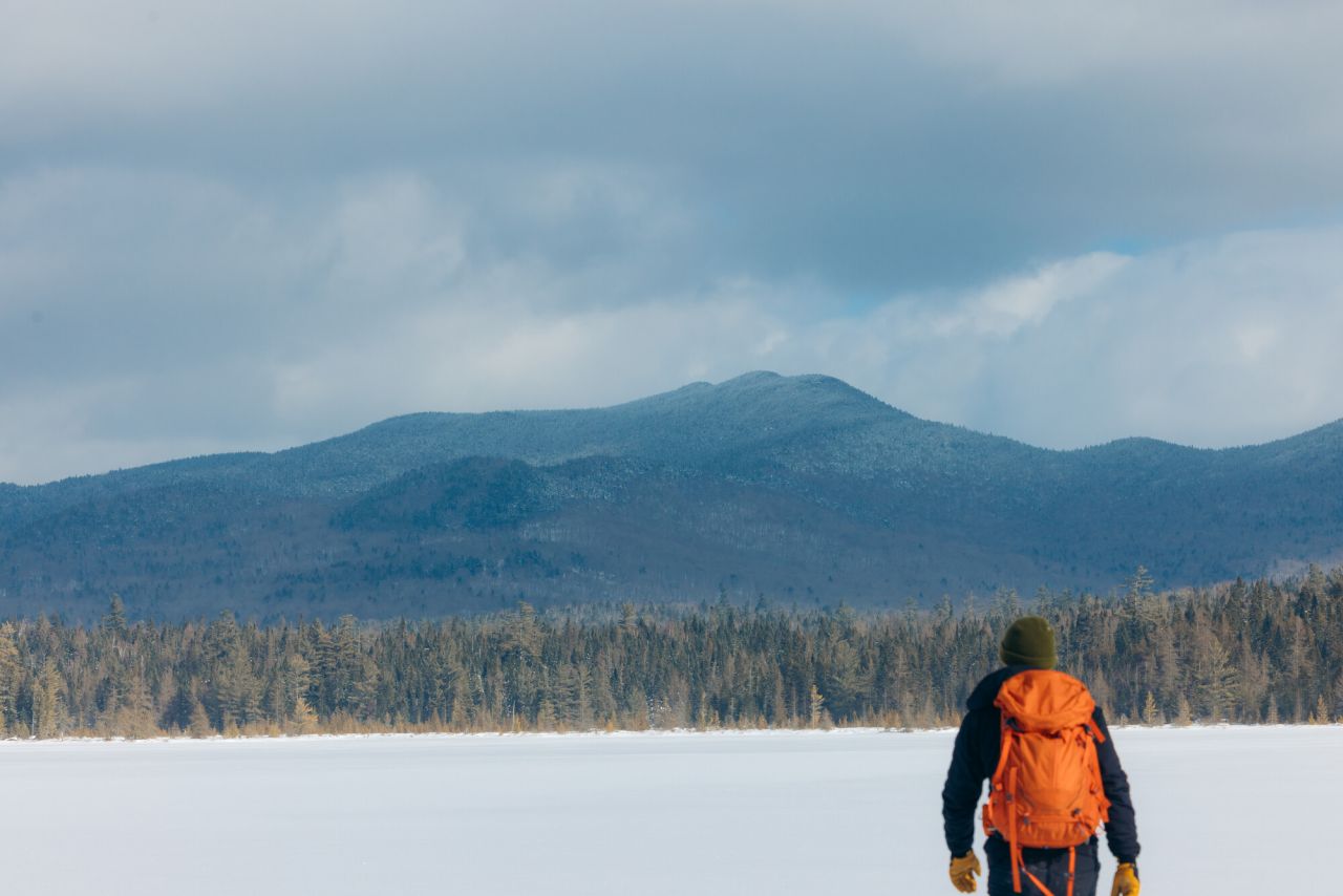 A hiker snowshoeing.