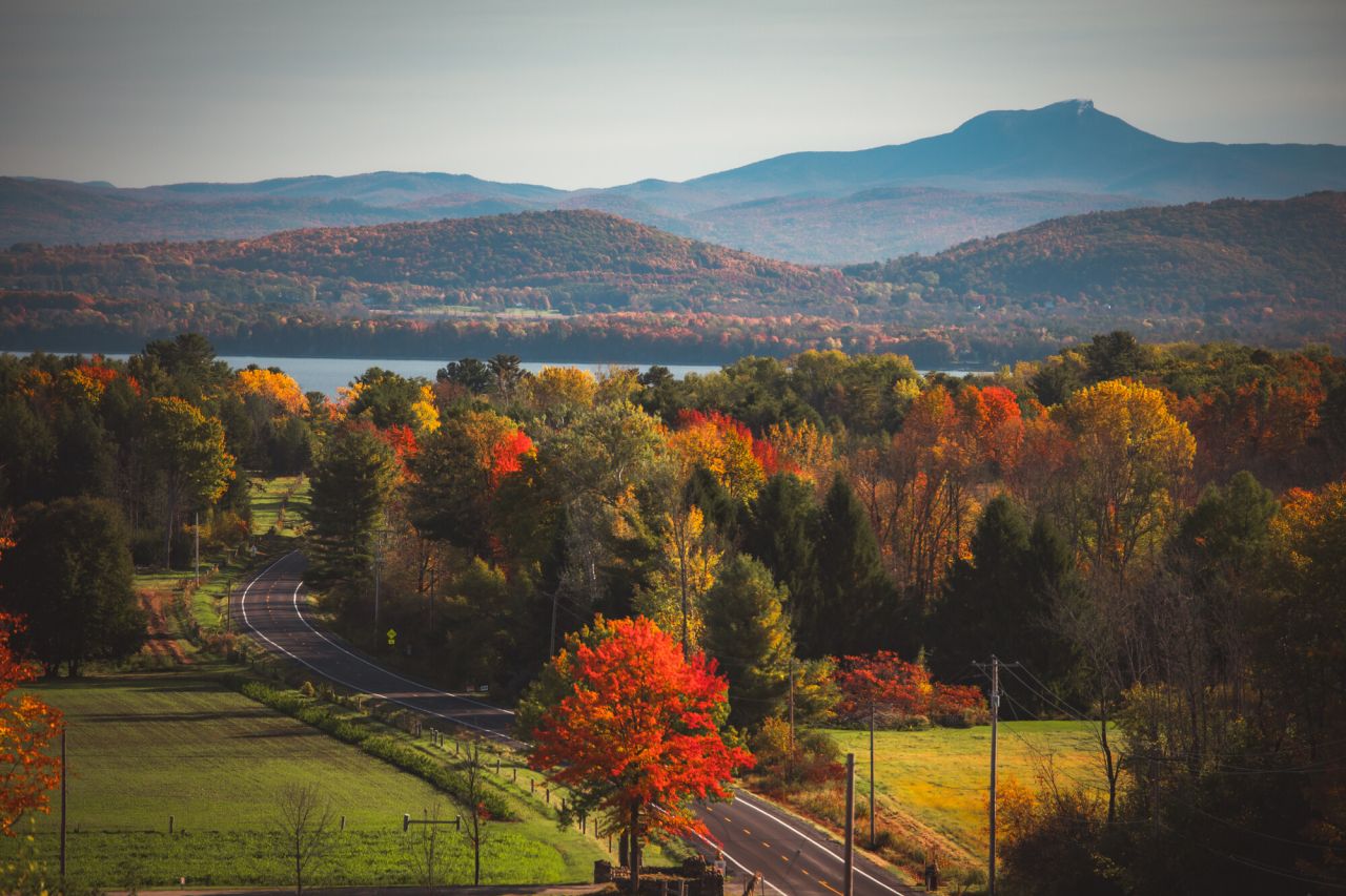 A view looking down over the Lake Champlain valley during fall.
