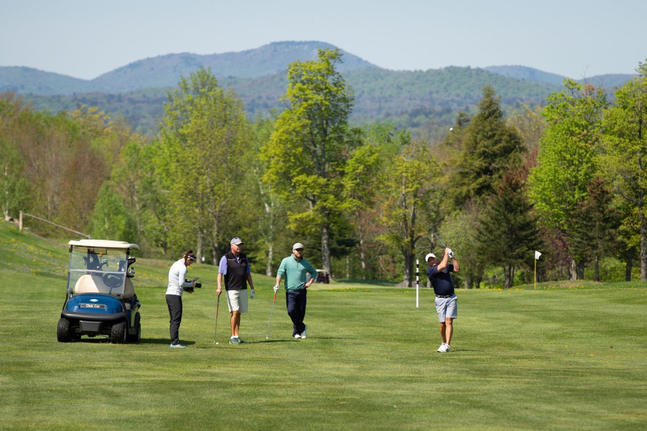 Tupper Lake Golf Club with people on the green