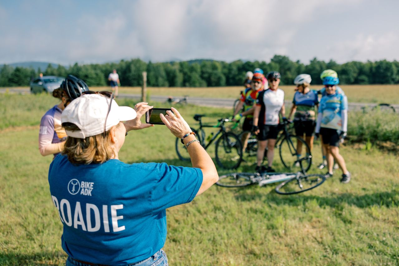 A group of bikers getting their photo taken at an event.