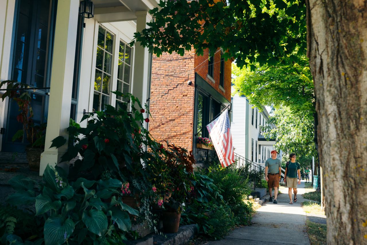 A couple walking the streets of historic Essex, NY