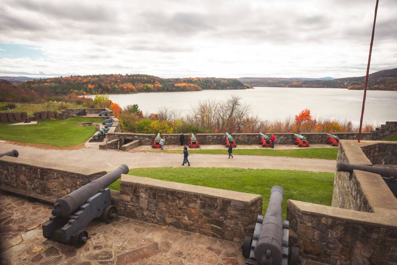 A fort overlooking a lake in fall. 