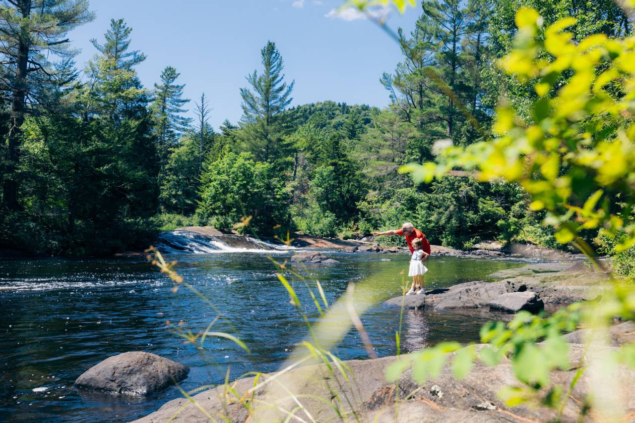 A grandfather and his niece at Bog River Falls.