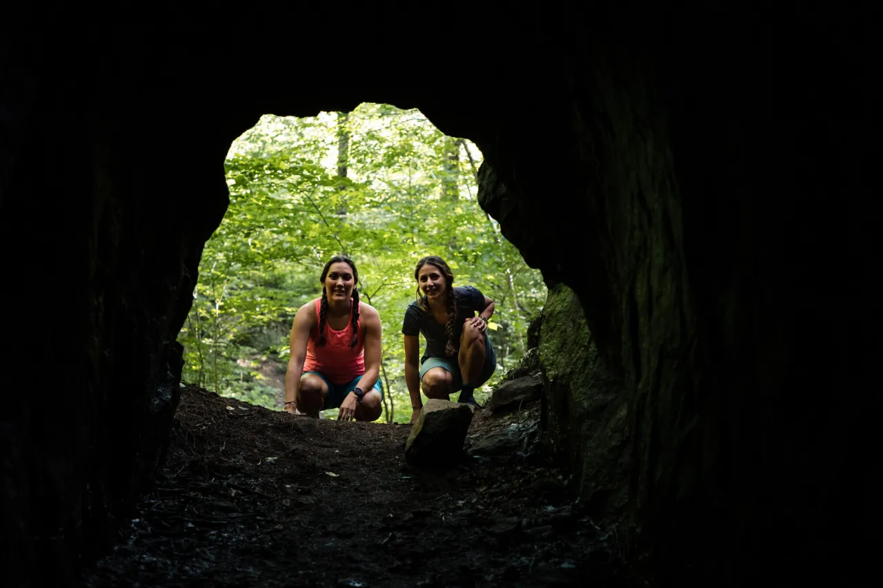A family exploring Kunjamuk Cave.