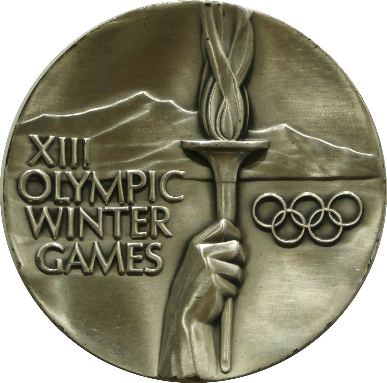 A silver medal from the 1980 Winter Olympics.