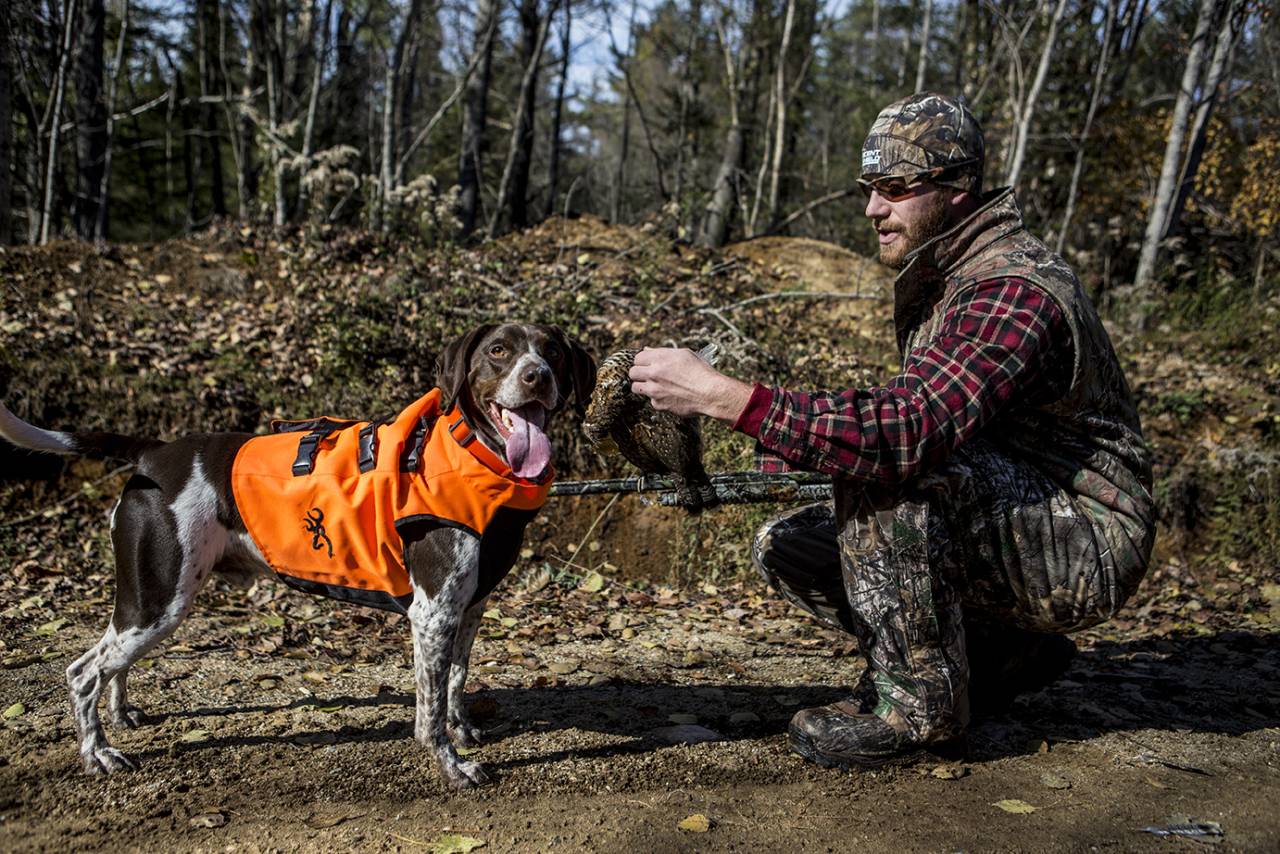 A hunter and his dog.