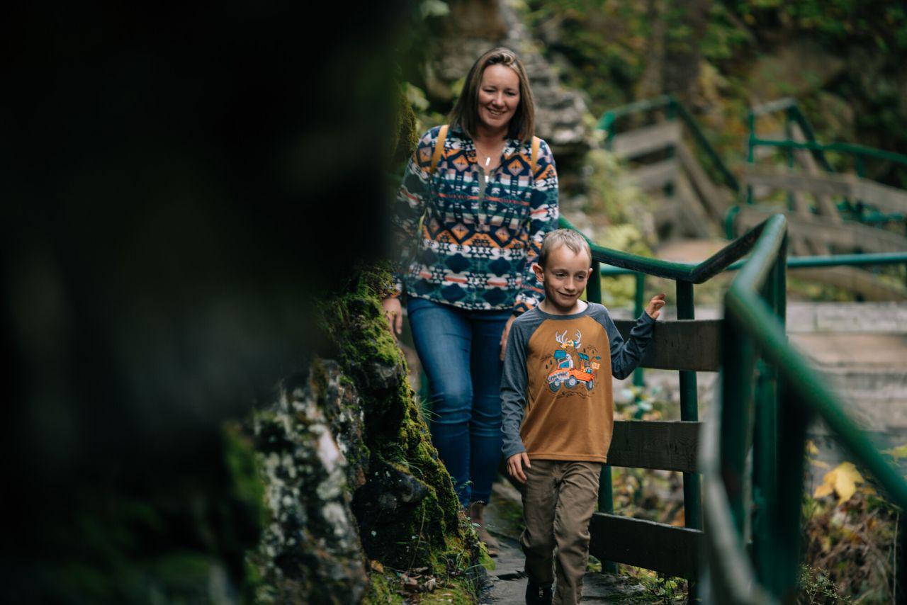 A mother and son walking in Ausable Chasm