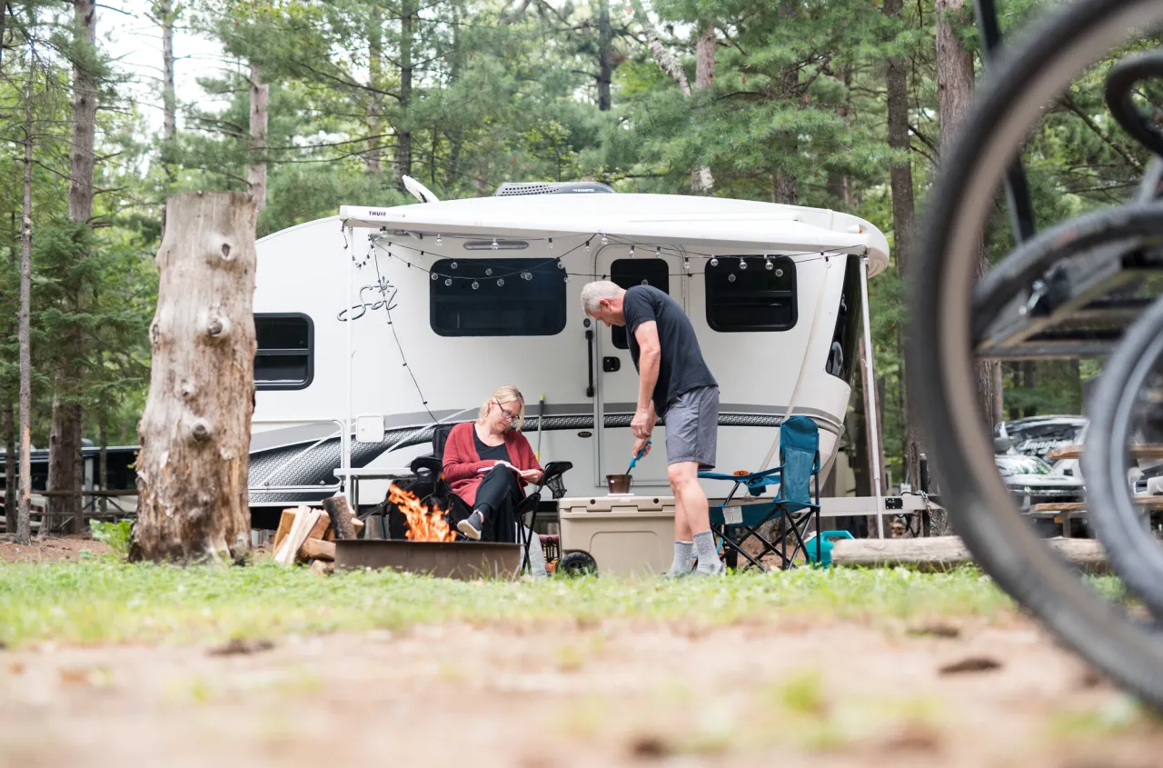 A couple camping in an RV.