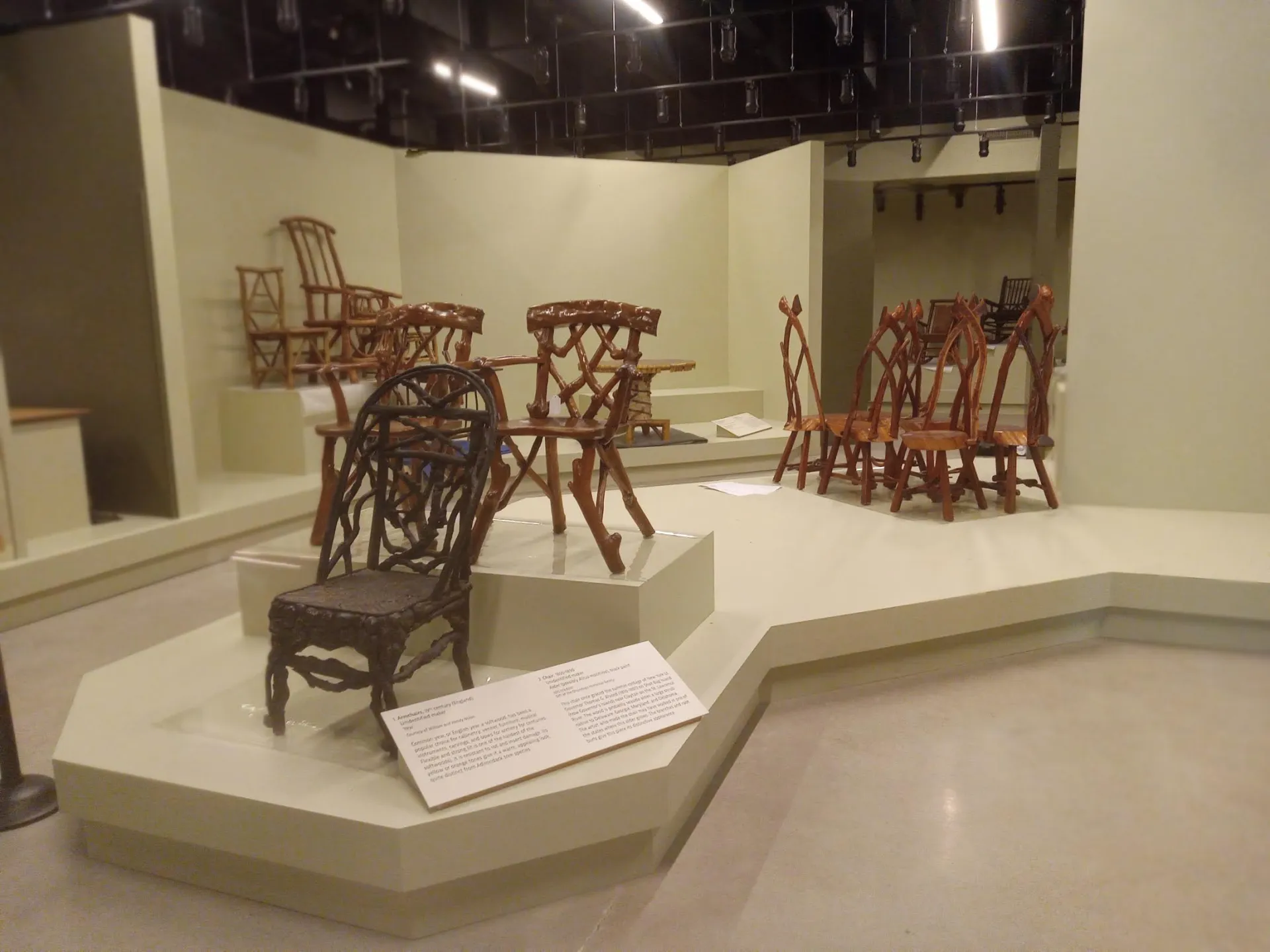 A new exhibit displaying many intricate, handmade chairs from centuries past