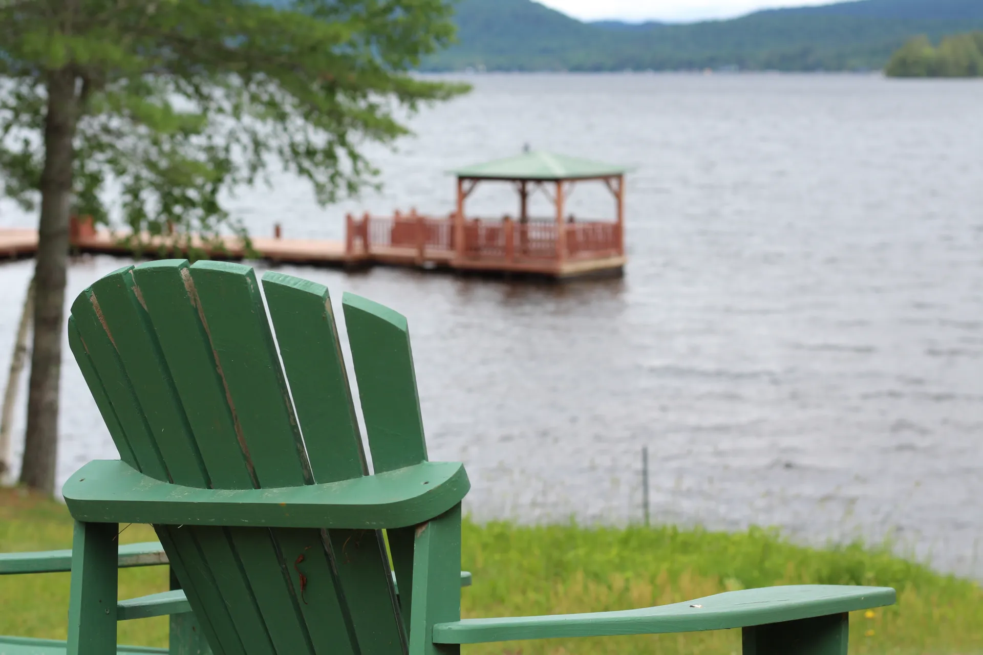 A gazebo floating on a dock in the water.